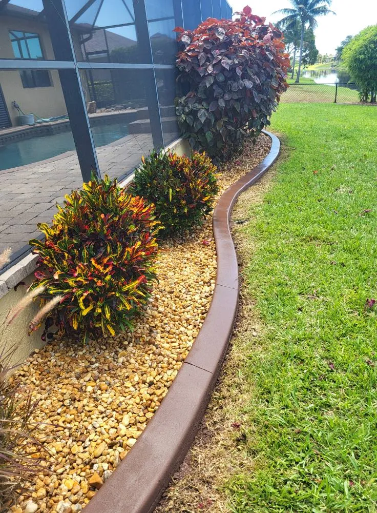 Lush green lawn and landscape beds in Southwest Florida